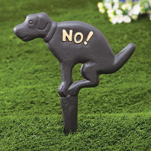 pooping dog figurine